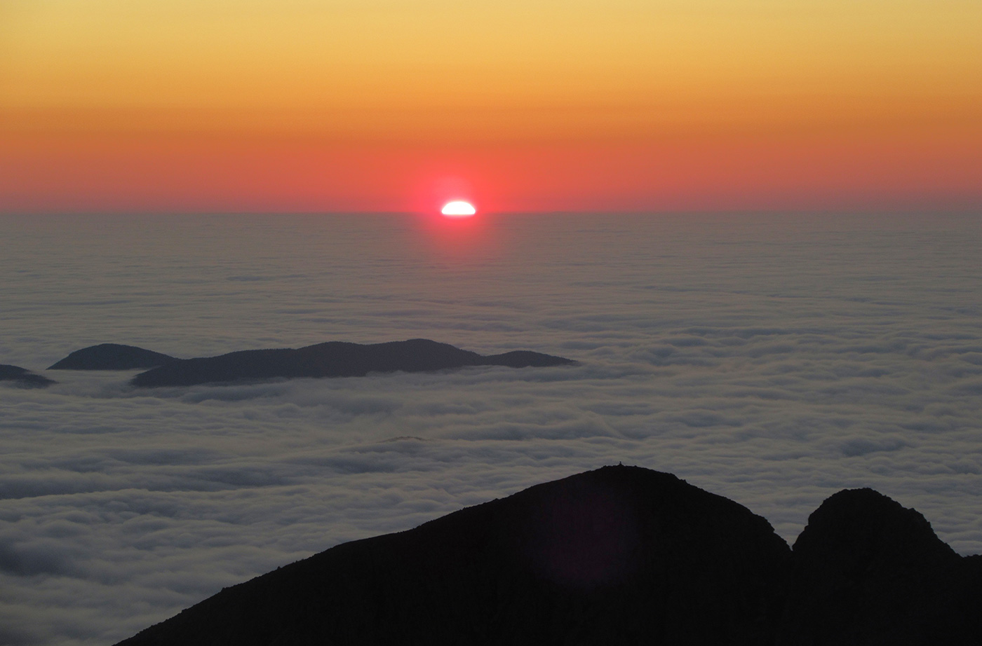 sunrise over clouds as seen from Katahdin