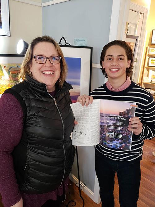 smiling holding magazine