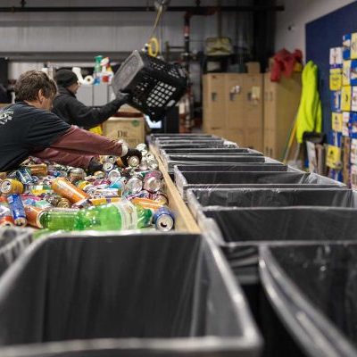 sorting bottles at redemption center