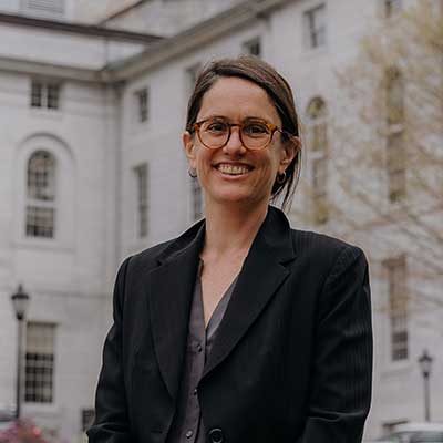 Rebecca Schultz smiling in front of State House