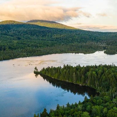 cloud-hugs-Mt-Chase-2-aerial-view-of-Pickett-Mountain-Pond-Monkman clouds over mountain with forests and pond in foreground