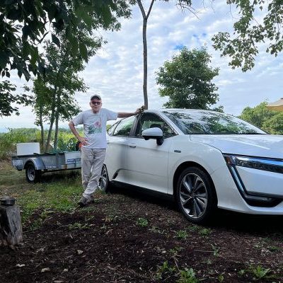 jim-ev-oldtown man with electric vehicle outside